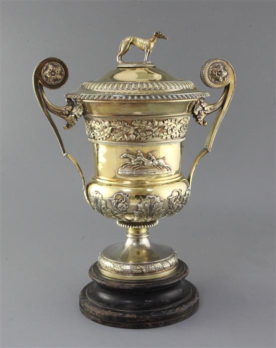 A handsome George III silver gilt two handled presentation pedestal trophy cup and cover by William Elliot, 93.5 oz.